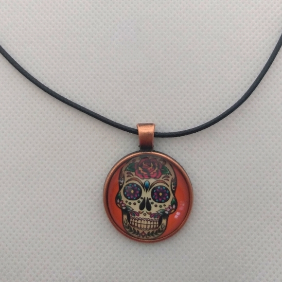 Handmade Orange Skull Necklace on Black Cord - Picture 2 of 2